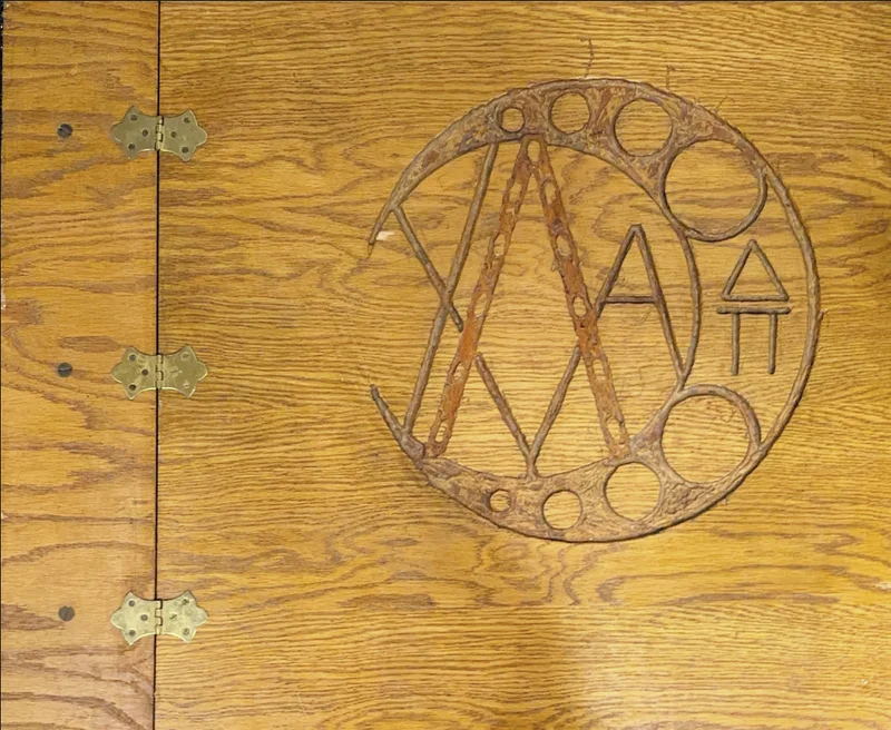 Wooden cover of an Epsilon-Mu chapter scrapbook